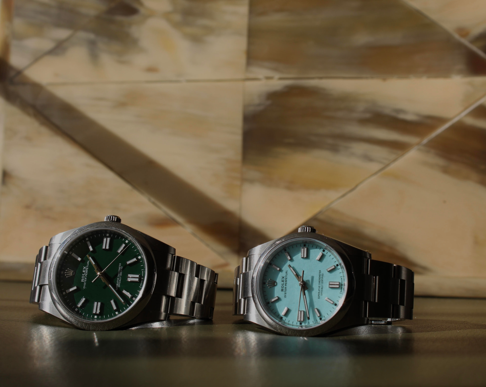 Luxury watches laid out on a surface